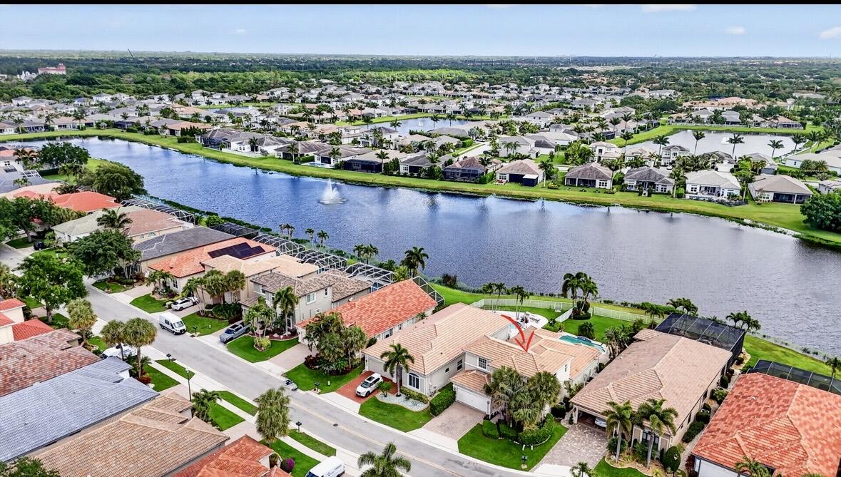 7879 Monarch Court Delray Beach, FL 33446 - Photo 4 of 74 an aerial view of a house with a lake view