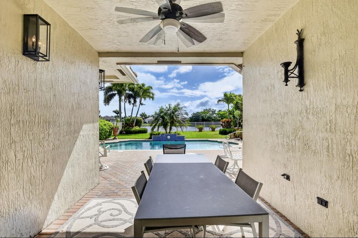 7879 Monarch Court Delray Beach, FL 33446 - Photo 45 of 74 a room with a table chair and a painting on the wall
