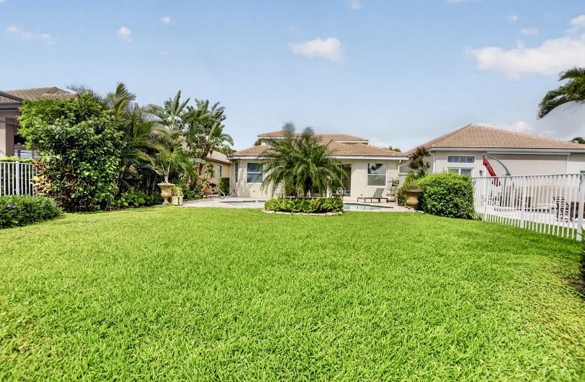 7879 Monarch Court Delray Beach, FL 33446 - Photo 52 of 74 a front view of a house with a yard