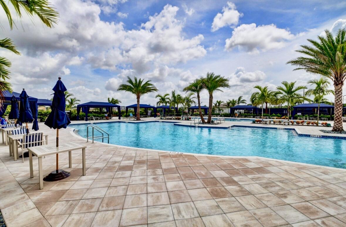 7879 Monarch Court Delray Beach, FL 33446 - Photo 62 of 74 a view of swimming pool with table and chairs
