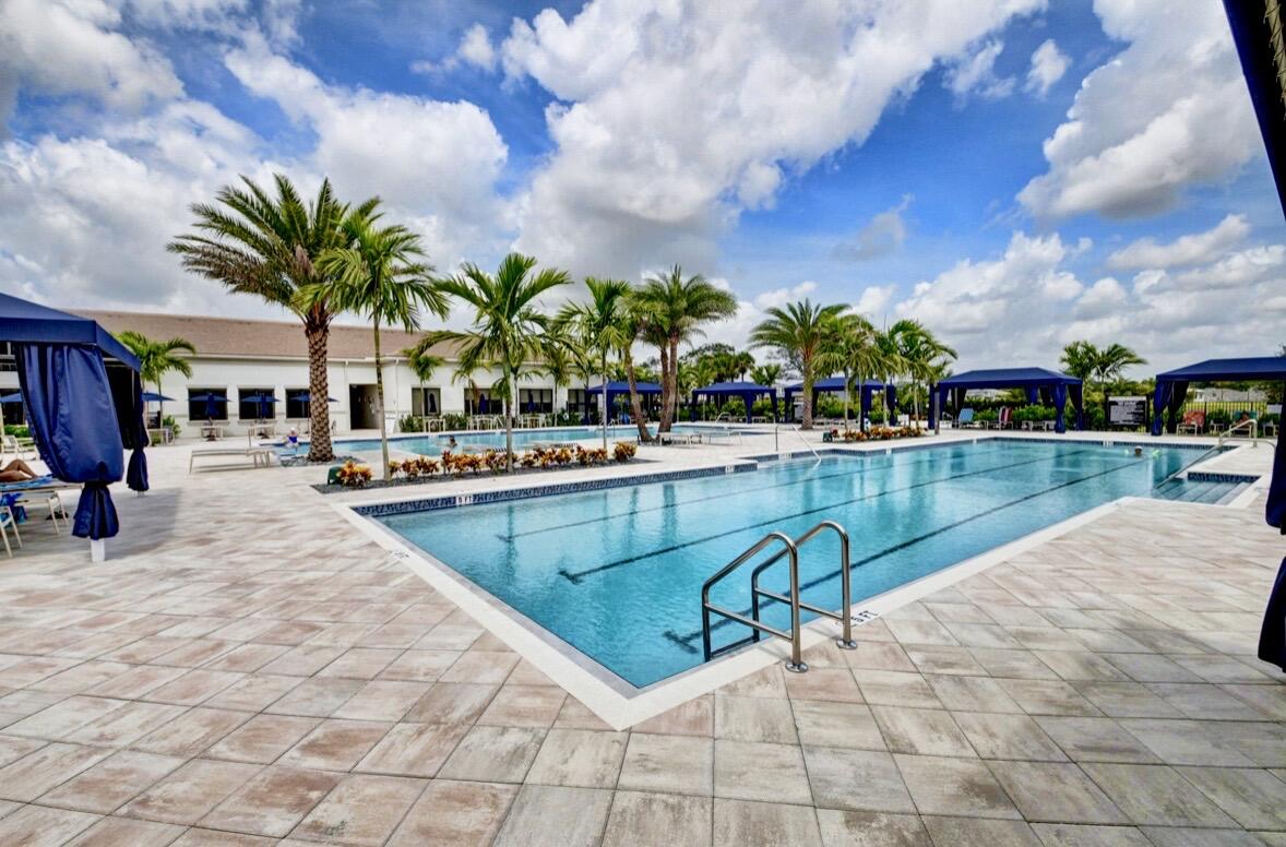 7879 Monarch Court Delray Beach, FL 33446 - Photo 64 of 74 a view of swimming pool with outdoor seating and plants