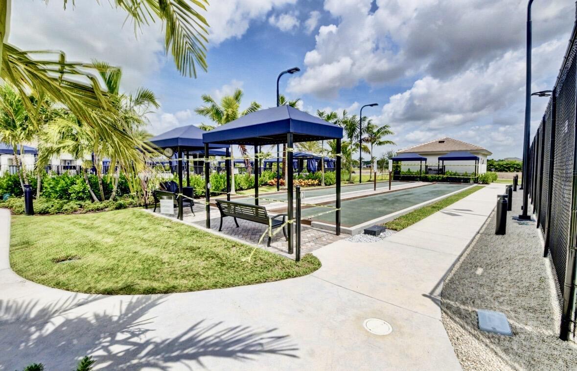 7879 Monarch Court Delray Beach, FL 33446 - Photo 68 of 74 a view of a backyard with sitting area