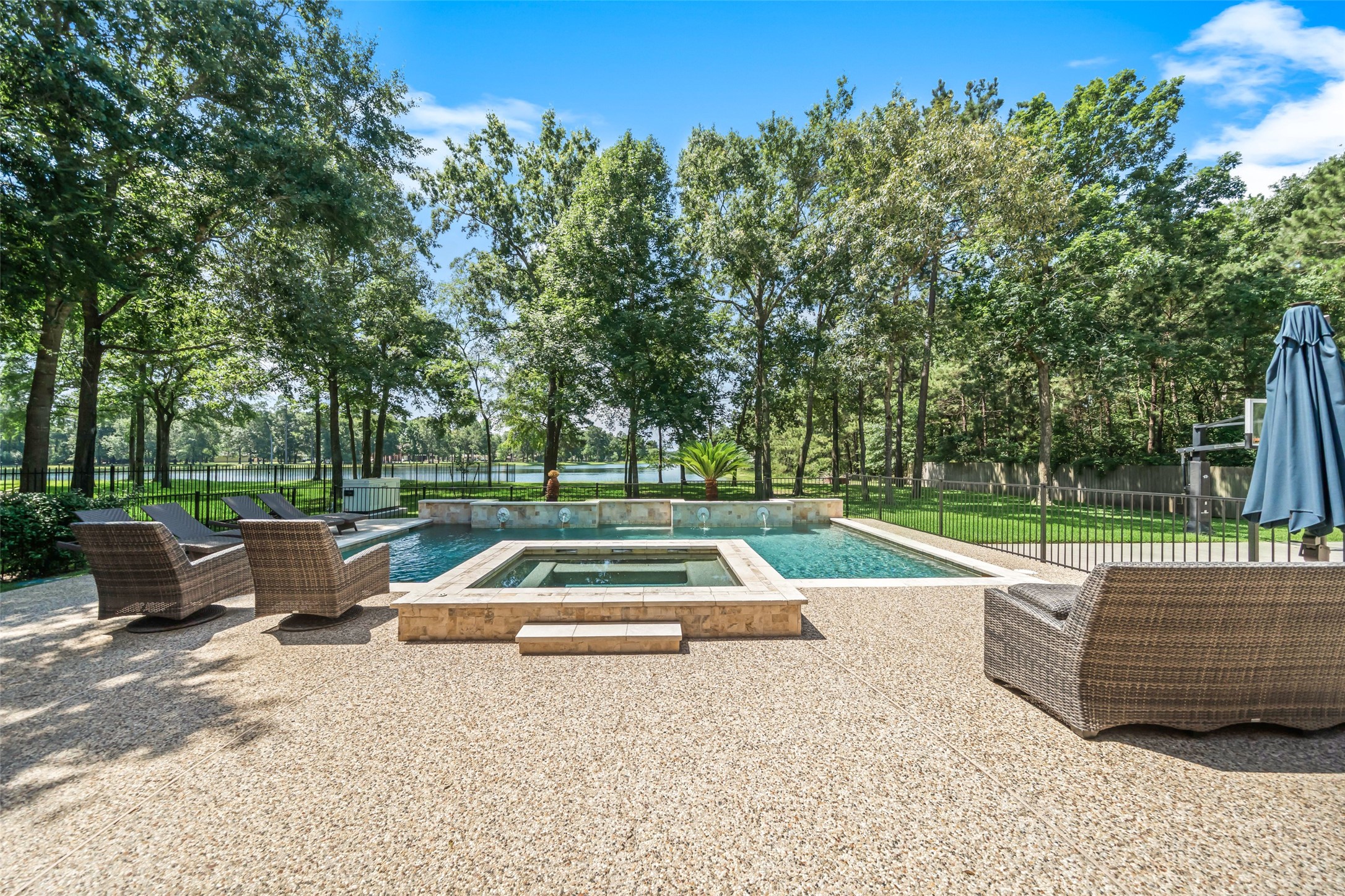 2302 Legends Shore Drive Spring, TX 77386 - Photo 21 of 48 Resort-style pool and spa surrounded by peaceful views and mature trees.