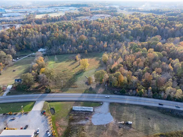 an aerial view of a house with a lake view