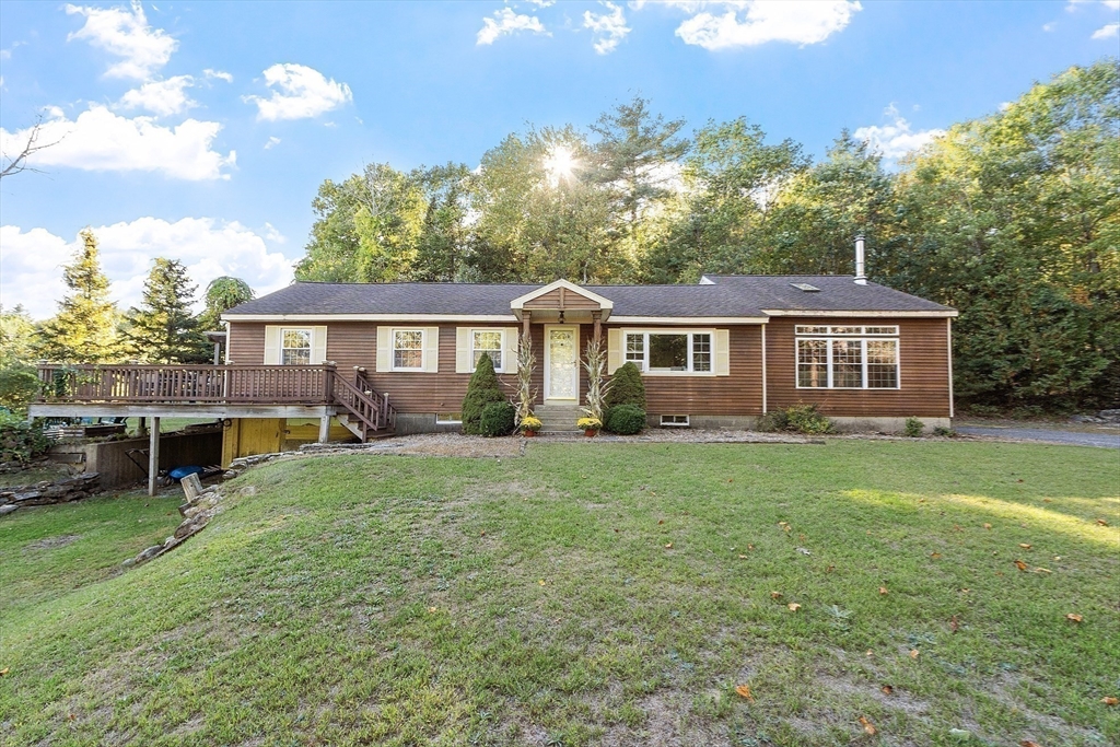 1249 Richardson Road Ashby, MA 01431 - Photo 1 of 31 a front view of a house with a garden