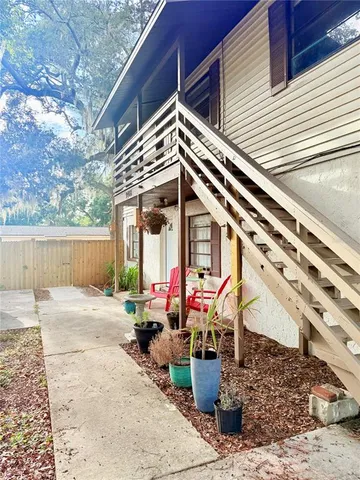 a view of a chairs and table in the patio