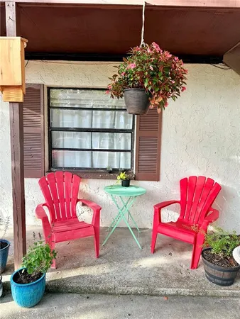 a view of a house with a potted plant