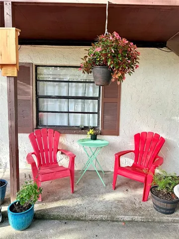 a view of a house with a potted plant