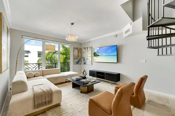 a living room with furniture or couch and a large window