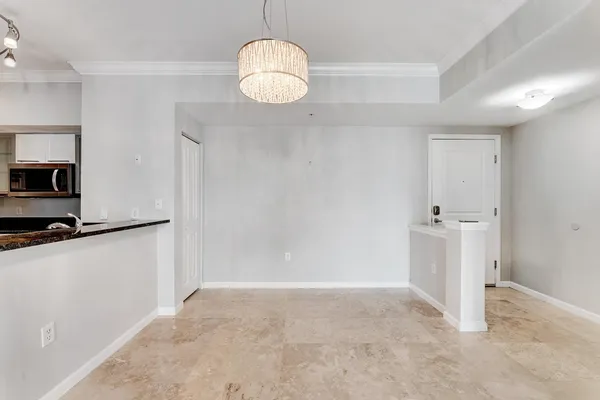 a view of a kitchen with wooden floor