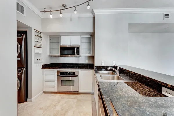 a kitchen with a stove and a refrigerator