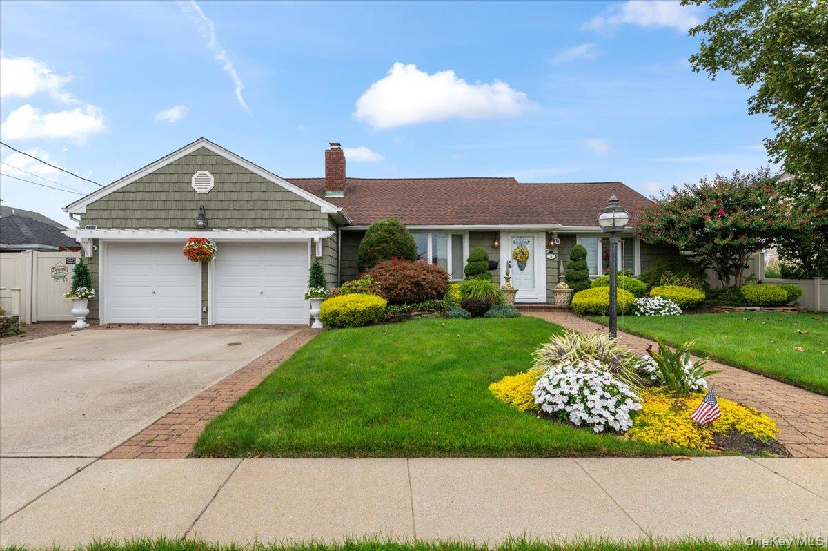5 Canal Road Massapequa, NY 11758 - Photo 1 of 1 Ranch-style home with concrete driveway, a chimney, and a garage