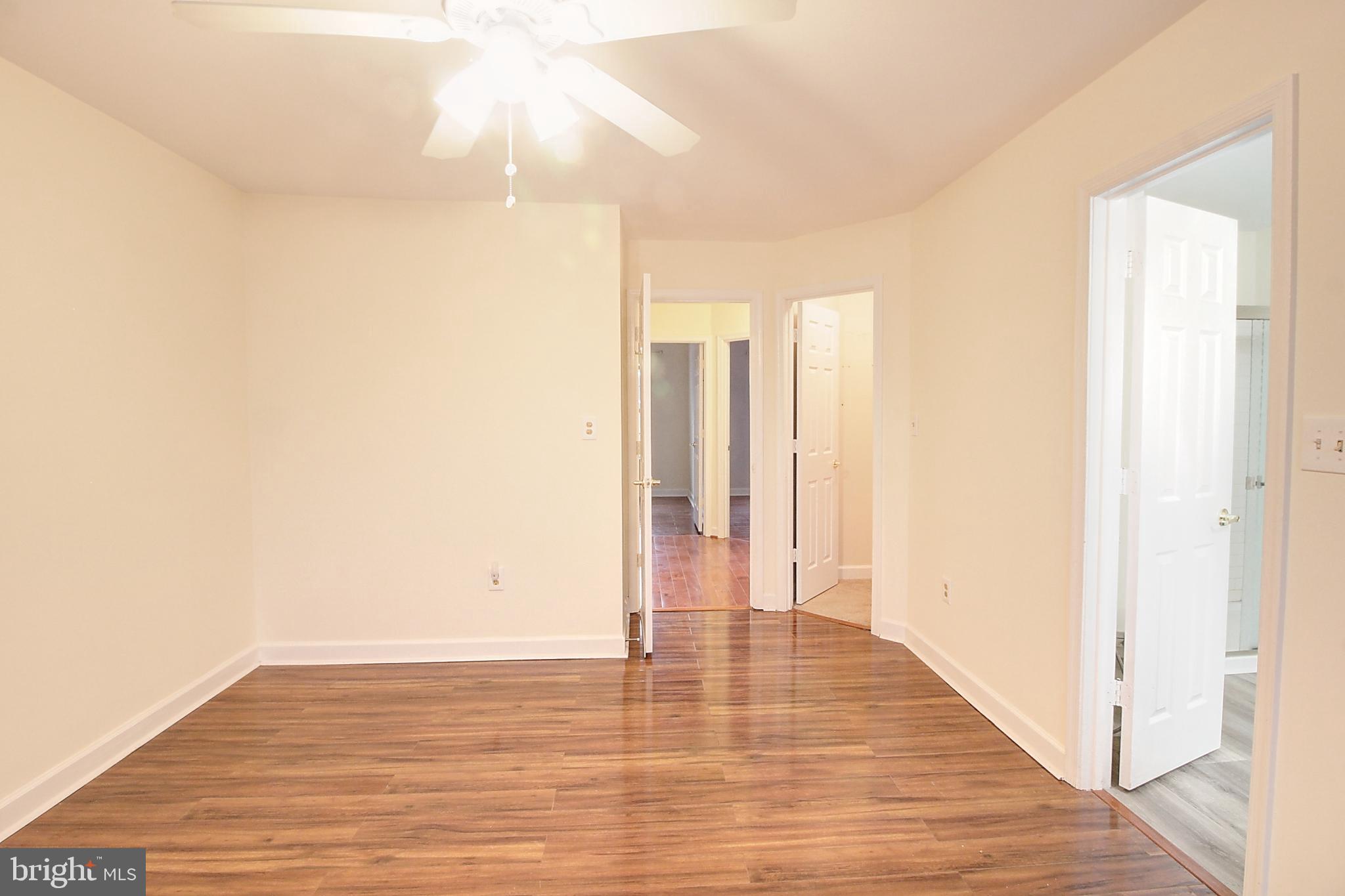 9261 Ridgefield Circle Frederick, MD 21701 - Photo 13 of 27 a view of an empty room with wooden floor