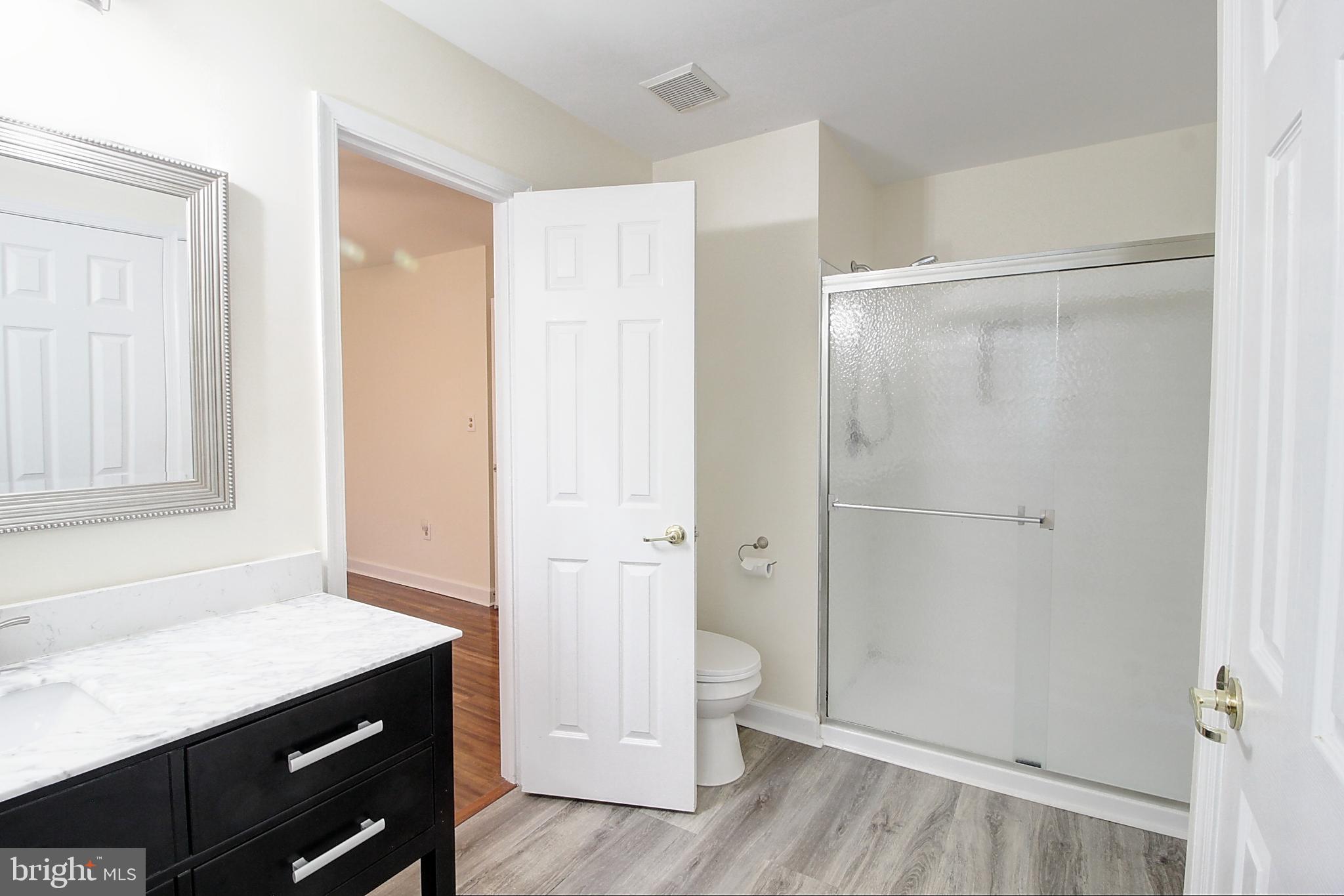 9261 Ridgefield Circle Frederick, MD 21701 - Photo 14 of 27 a view of an empty room with wooden floor