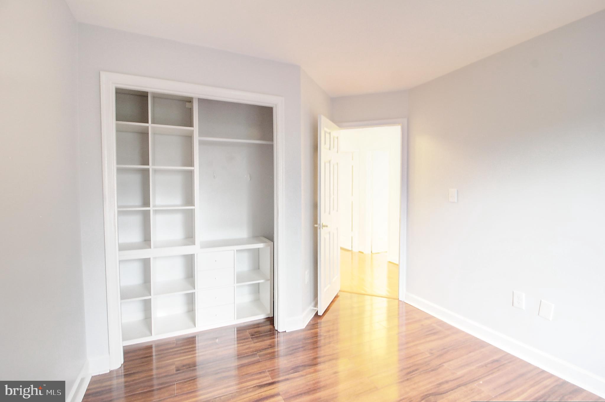 9261 Ridgefield Circle Frederick, MD 21701 - Photo 16 of 27 a view of an empty room with wooden floor and a window
