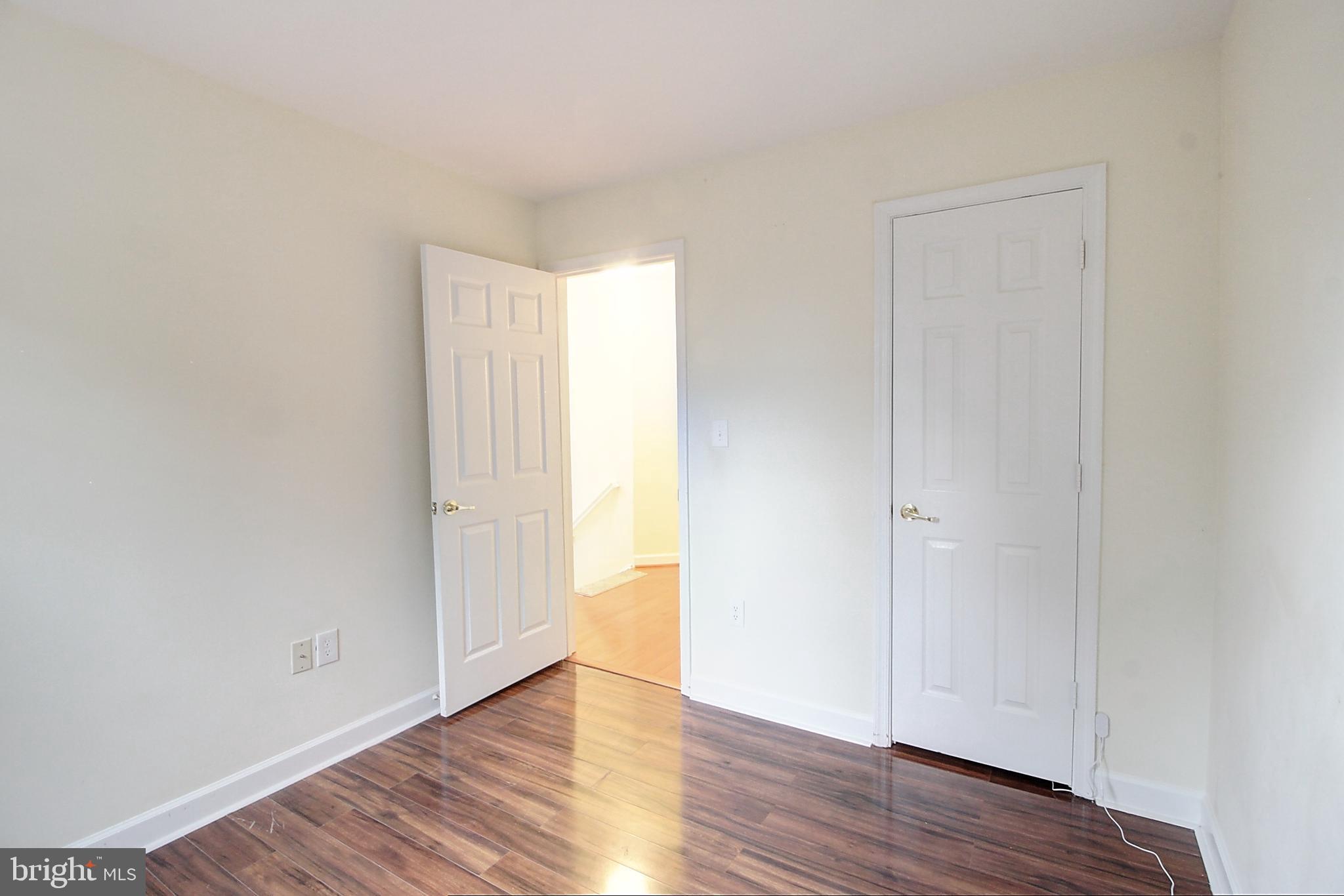 9261 Ridgefield Circle Frederick, MD 21701 - Photo 18 of 27 a view of an empty room with wooden floor