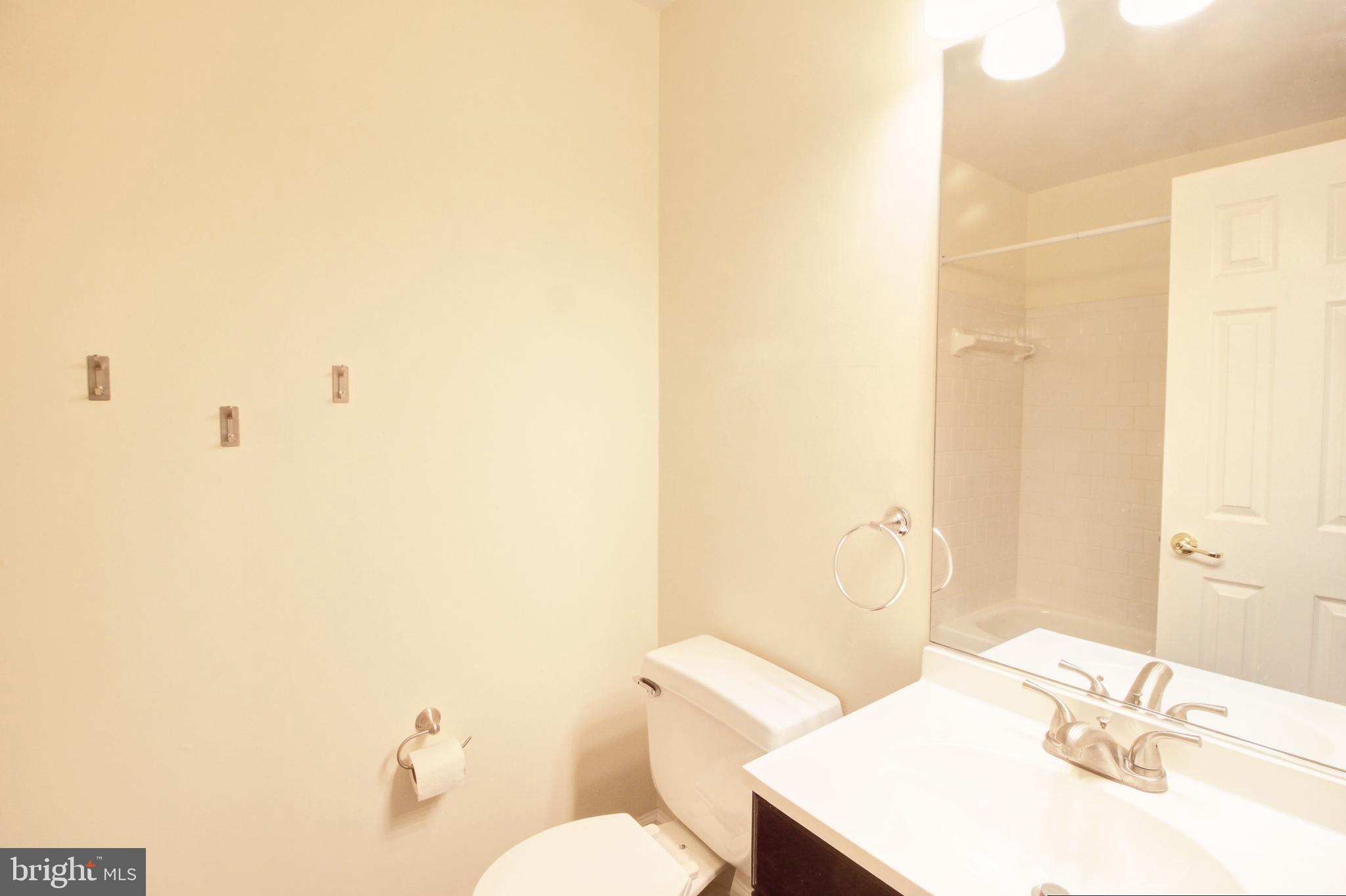 9261 Ridgefield Circle Frederick, MD 21701 - Photo 20 of 27 a bathroom with a sink a toilet and shower