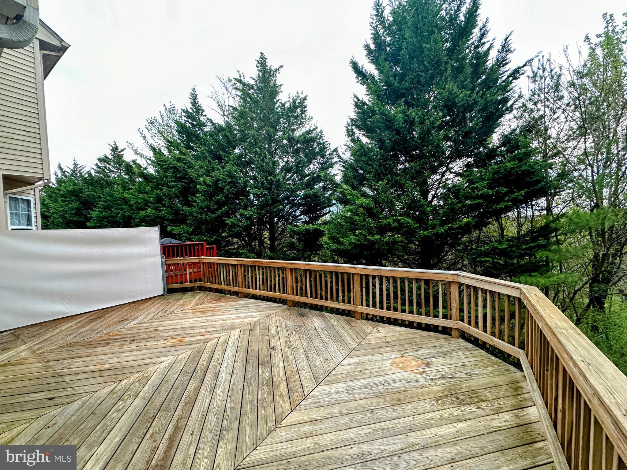 9261 Ridgefield Circle Frederick, MD 21701 - Photo 23 of 27 a view of balcony with wooden floor and fence