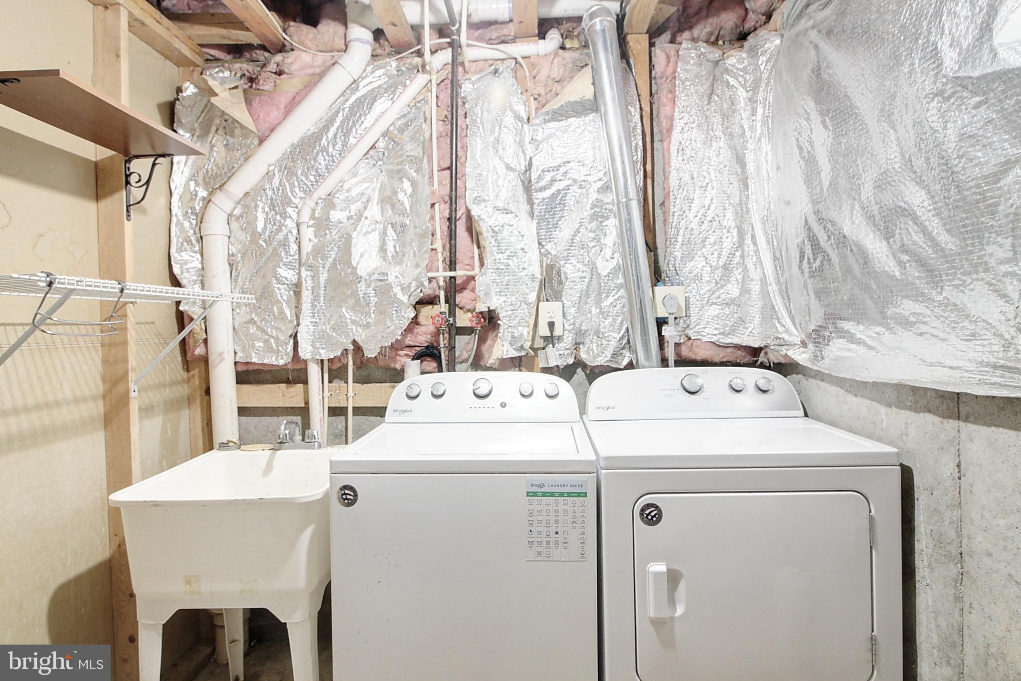 9261 Ridgefield Circle Frederick, MD 21701 - Photo 26 of 27 a utility room with dryer and washer