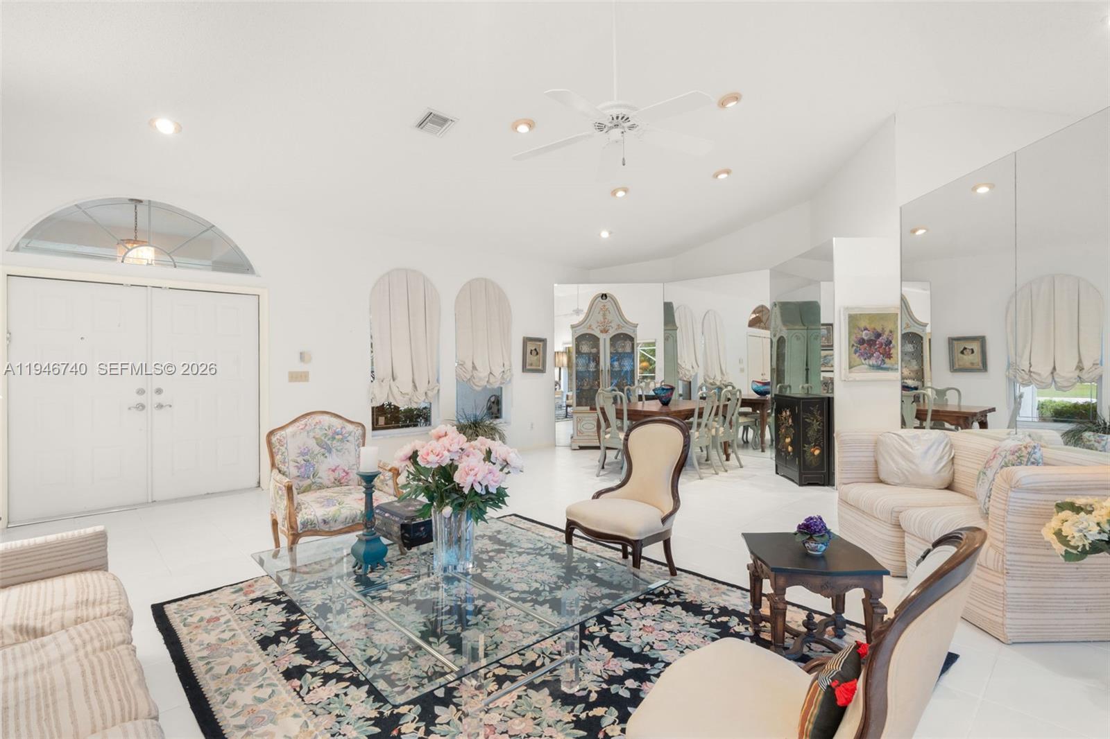 7901 Northwest 86th Terrace Tamarac, FL 33321 - Photo 11 of 42 a living room with lots of furniture and view of kitchen