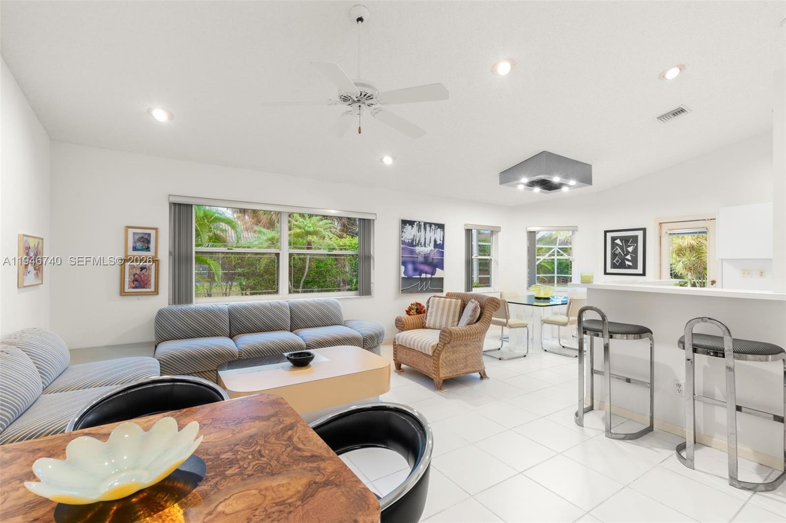 7901 Northwest 86th Terrace Tamarac, FL 33321 - Photo 17 of 42 a living room with furniture and a large window