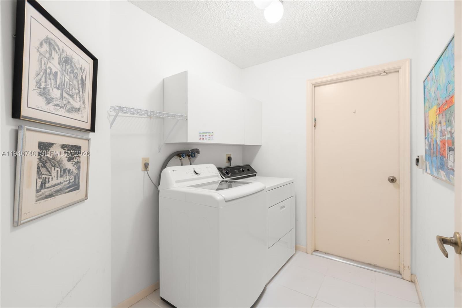 7901 Northwest 86th Terrace Tamarac, FL 33321 - Photo 28 of 42 a utility room with dryer and washer