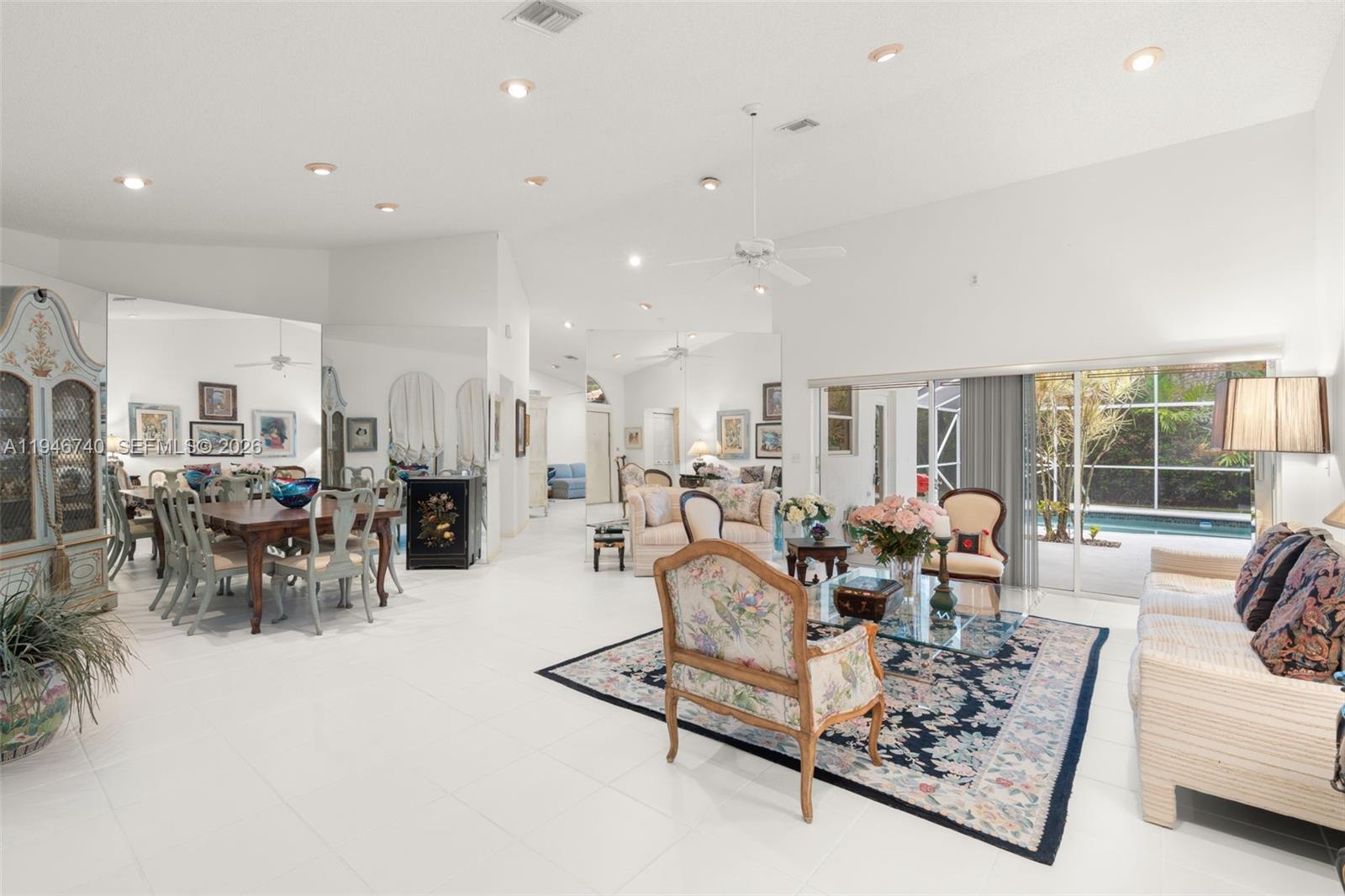 7901 Northwest 86th Terrace Tamarac, FL 33321 - Photo 3 of 42 a living room with furniture and a large window