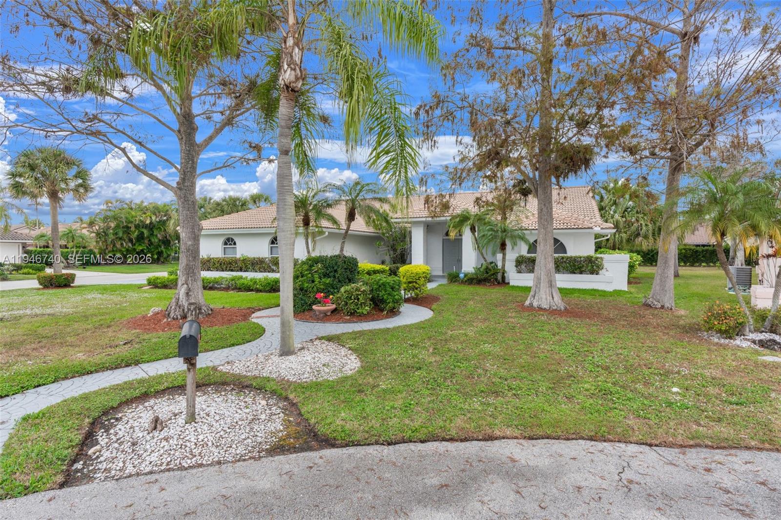 7901 Northwest 86th Terrace Tamarac, FL 33321 - Photo 7 of 42 a view of a garden with a fountain