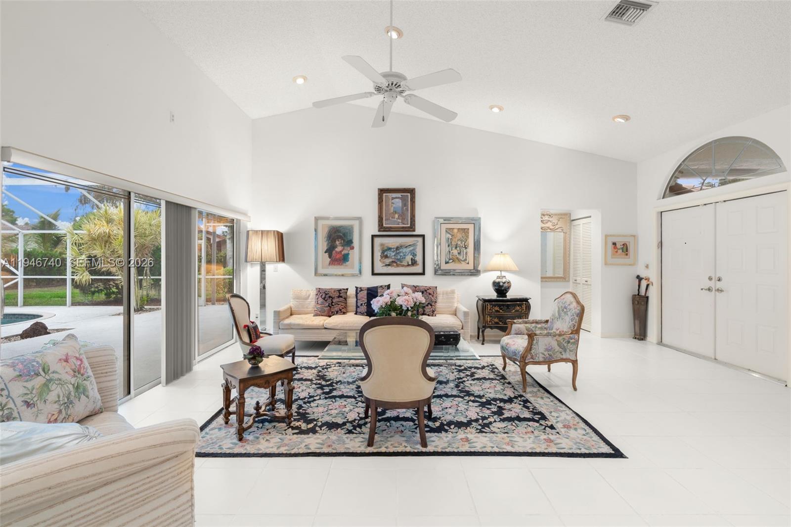7901 Northwest 86th Terrace Tamarac, FL 33321 - Photo 9 of 42 a living room with fireplace furniture and a table
