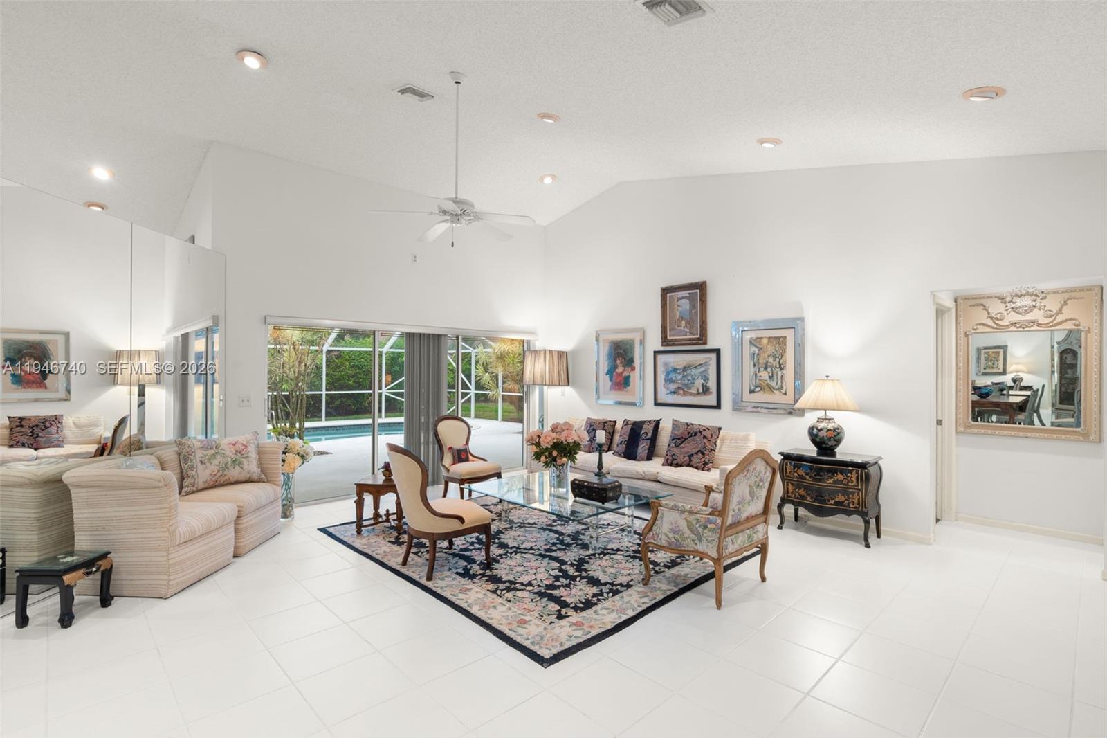 7901 Northwest 86th Terrace Tamarac, FL 33321 - Photo 10 of 42 a living room with furniture large window and a table