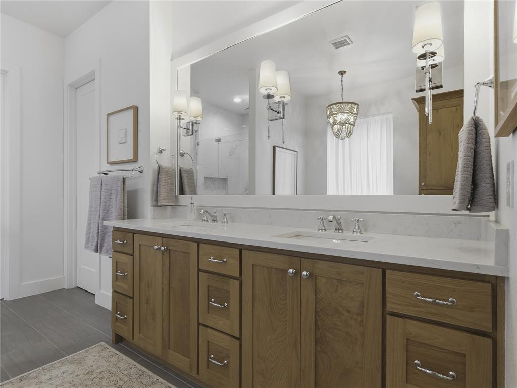4211 Azalea Way Midlothian, TX 76065 - Photo 21 of 39 Double vanity with wood-finish cabinetry, white countertop, and dual sinks