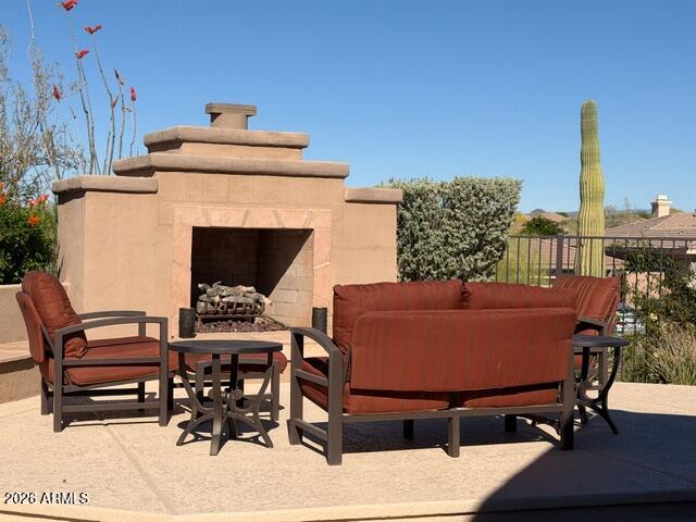 42026 North Moss Springs Road Anthem, AZ 85086 - Photo 13 of 16 Great raised sitting area w/fireplace