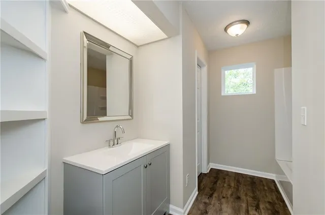 a bathroom with a sink and a mirror