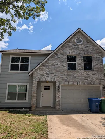 a front view of a house with yard