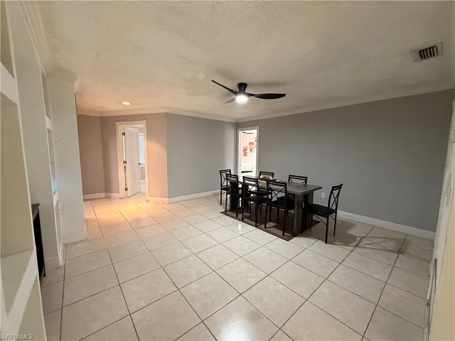 a view of a chairs and a table in a room