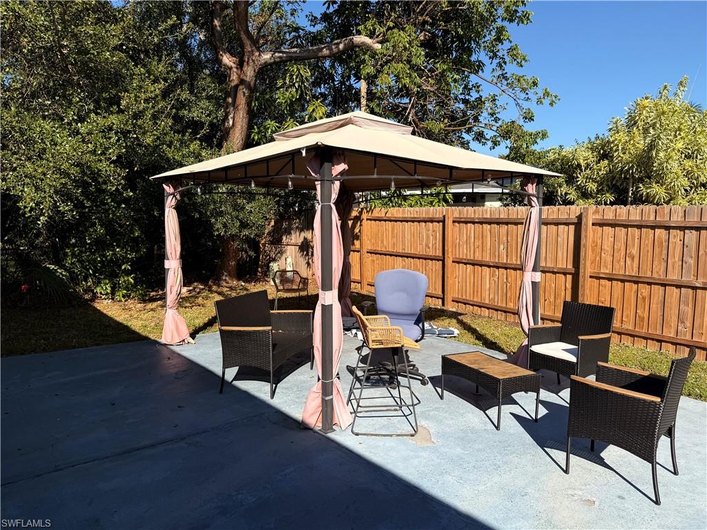 3536 Bolero Way Naples, FL 34105 - Photo 25 of 25 Fenced backyard featuring a gazebo, an outdoor hangout area, and a patio