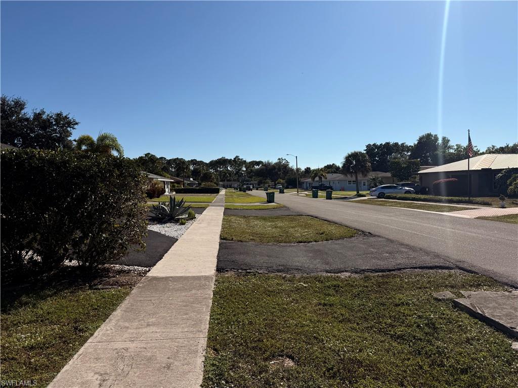 3536 Bolero Way Naples, FL 34105 - Photo 5 of 25 View of asphalt road featuring sidewalks and street lights