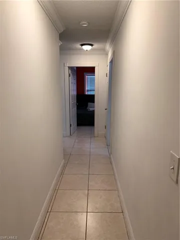 a view of hallway with an empty room