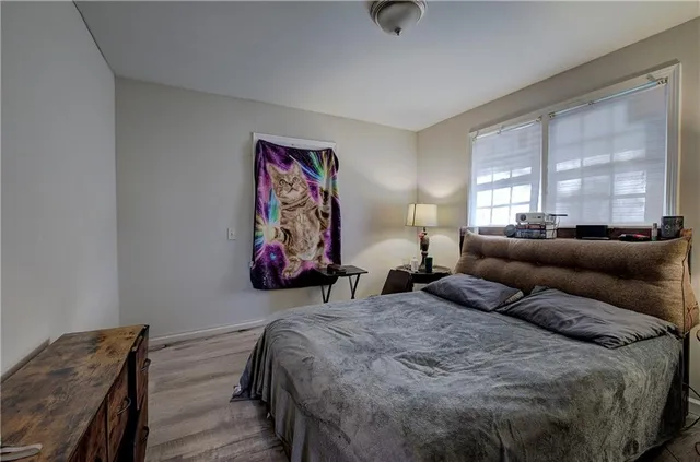 a bedroom with a bed and window