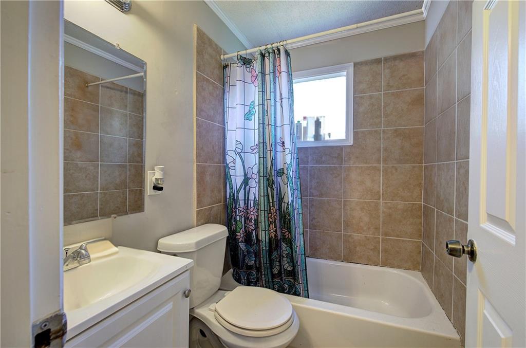 3 Grover Street Southwest Rome, GA 30161 - Photo 14 of 19 a bathroom with a toilet a sink and shower