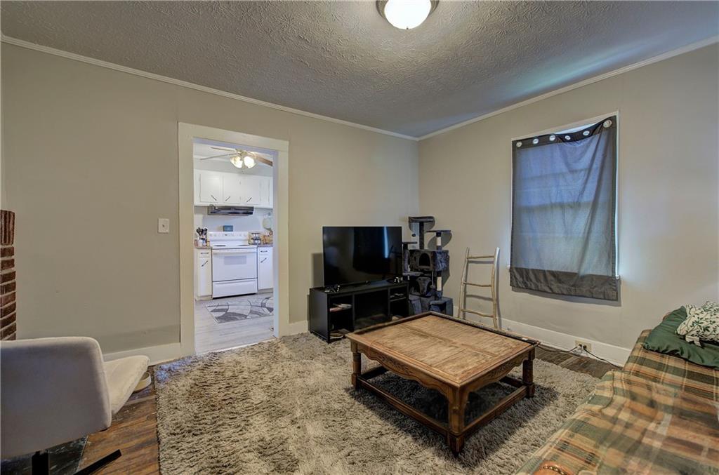 3 Grover Street Southwest Rome, GA 30161 - Photo 16 of 19 a living room with furniture and a flat screen tv