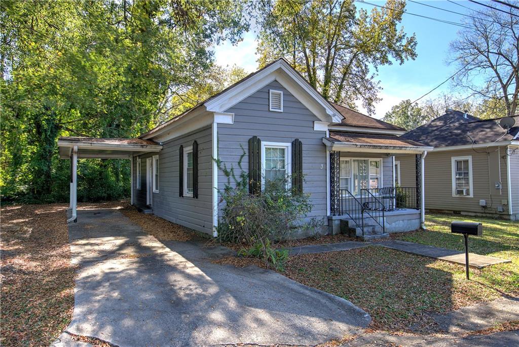 3 Grover Street Southwest Rome, GA 30161 - Photo 2 of 19 a front view of house with yard and outdoor seating