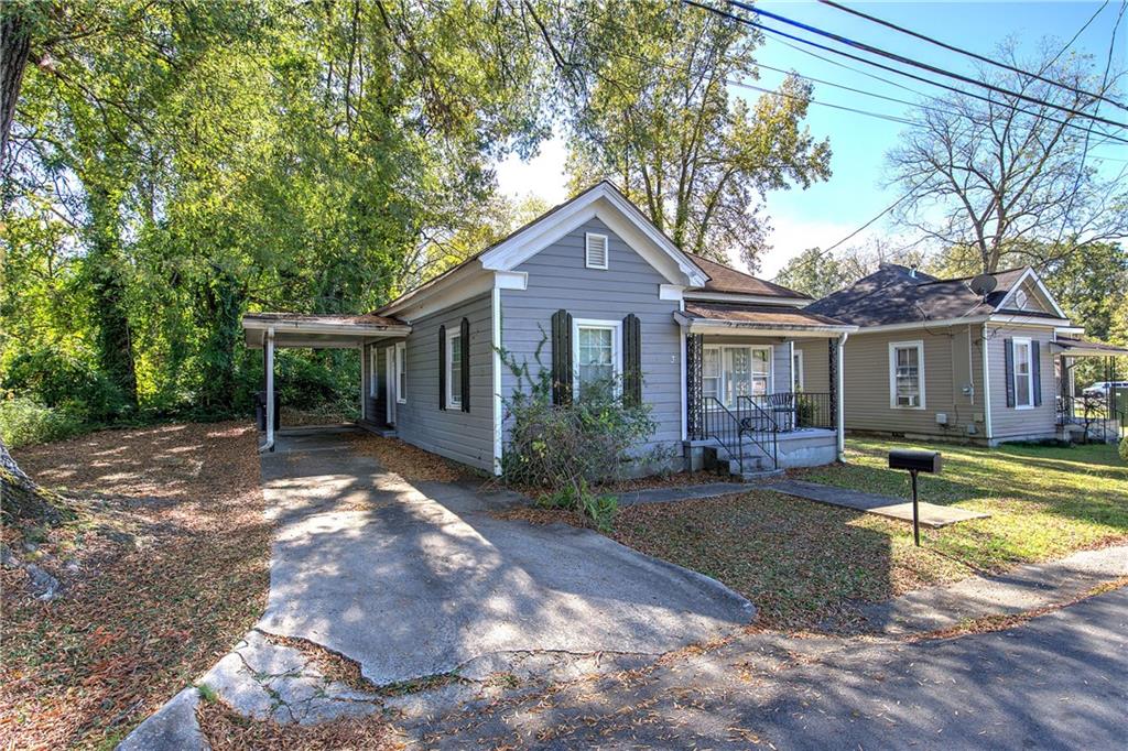 3 Grover Street Southwest Rome, GA 30161 - Photo 3 of 19 a front view of a house with a yard and porch