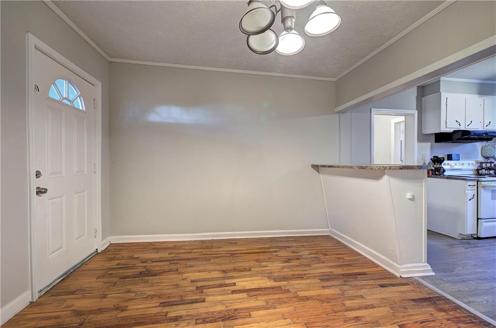 3 Grover Street Southwest Rome, GA 30161 - Photo 7 of 19 a view of a kitchen with a microwave and cabinets