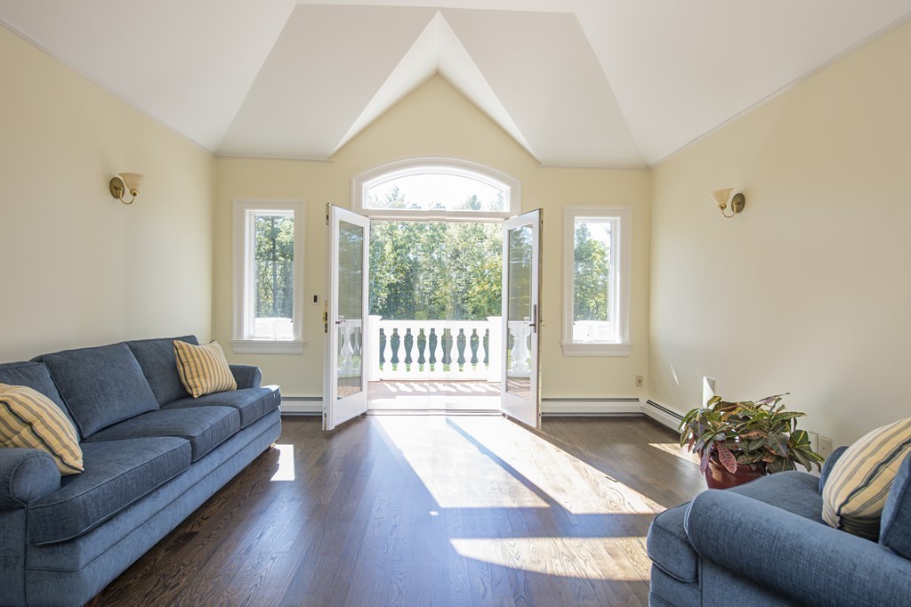 70 Black Oak Road Weston, MA 02493 - Photo 15 of 23 a living room with furniture and a large window