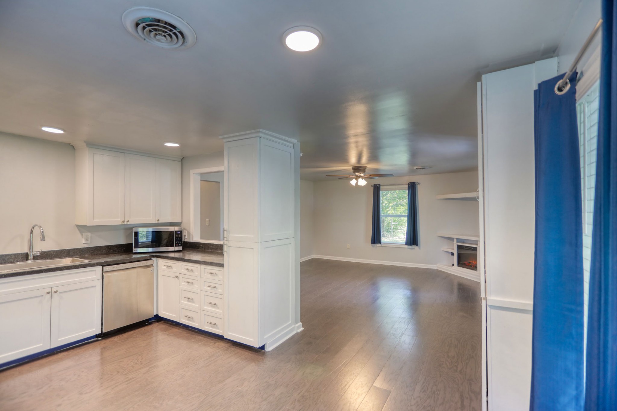 812 Butler Road Portland, TN 37148 - Photo 5 of 13 a kitchen with granite countertop a sink and cabinets