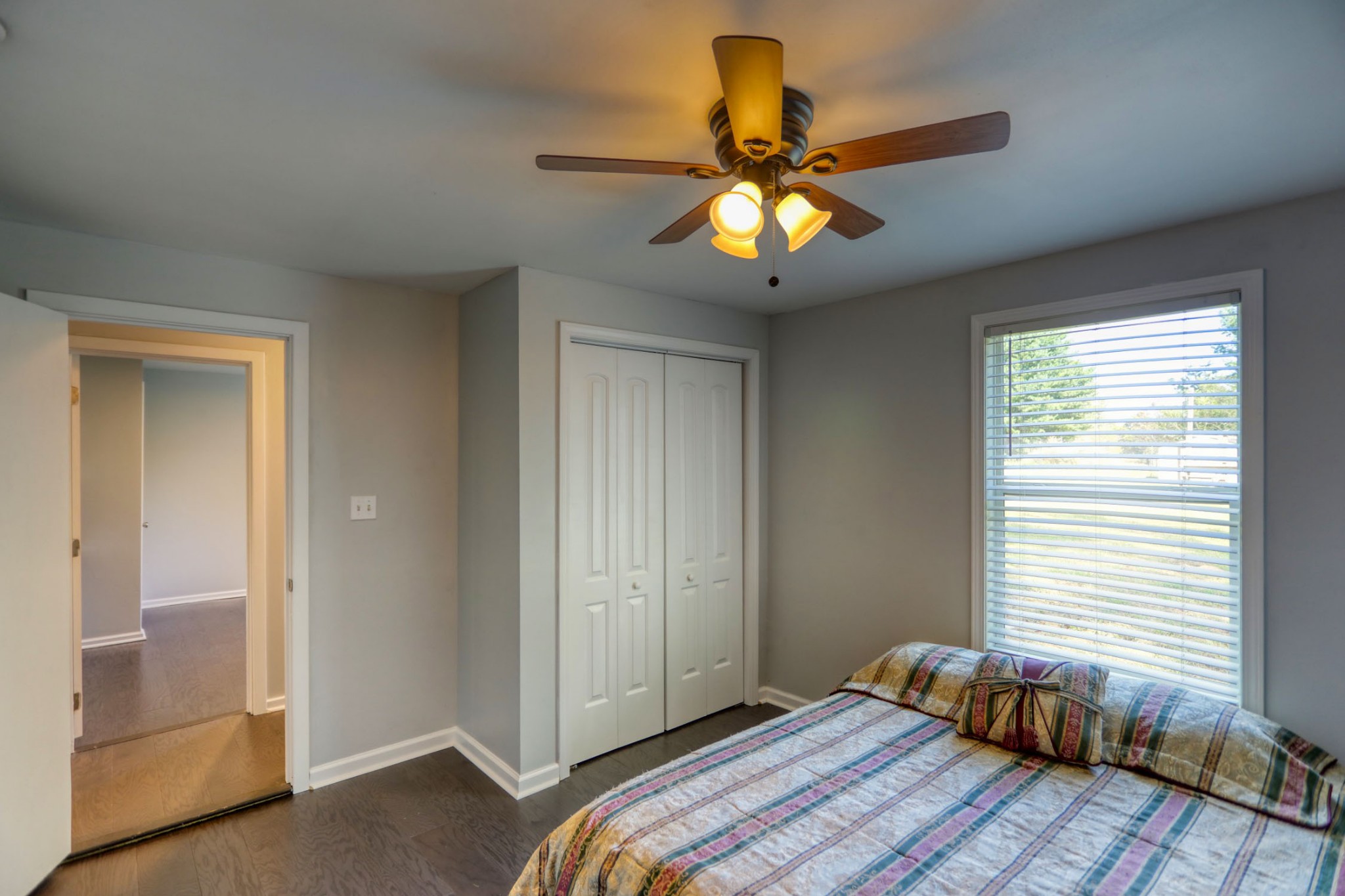 812 Butler Road Portland, TN 37148 - Photo 7 of 13 a bedroom with a bed and a chandelier