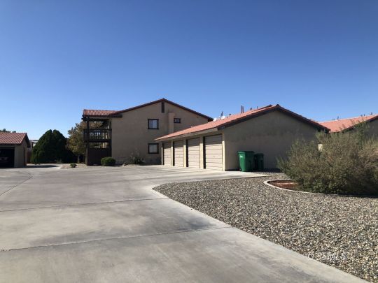 1331 North El Prado Drive Ridgecrest, CA 93555 - Photo 6 of 13 a front view of a house with a yard