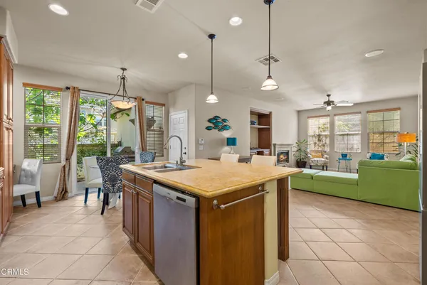 a kitchen with a table and chairs