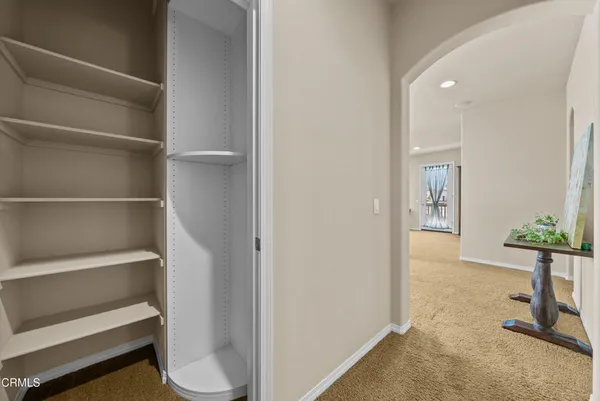 a bedroom with two beds and windows